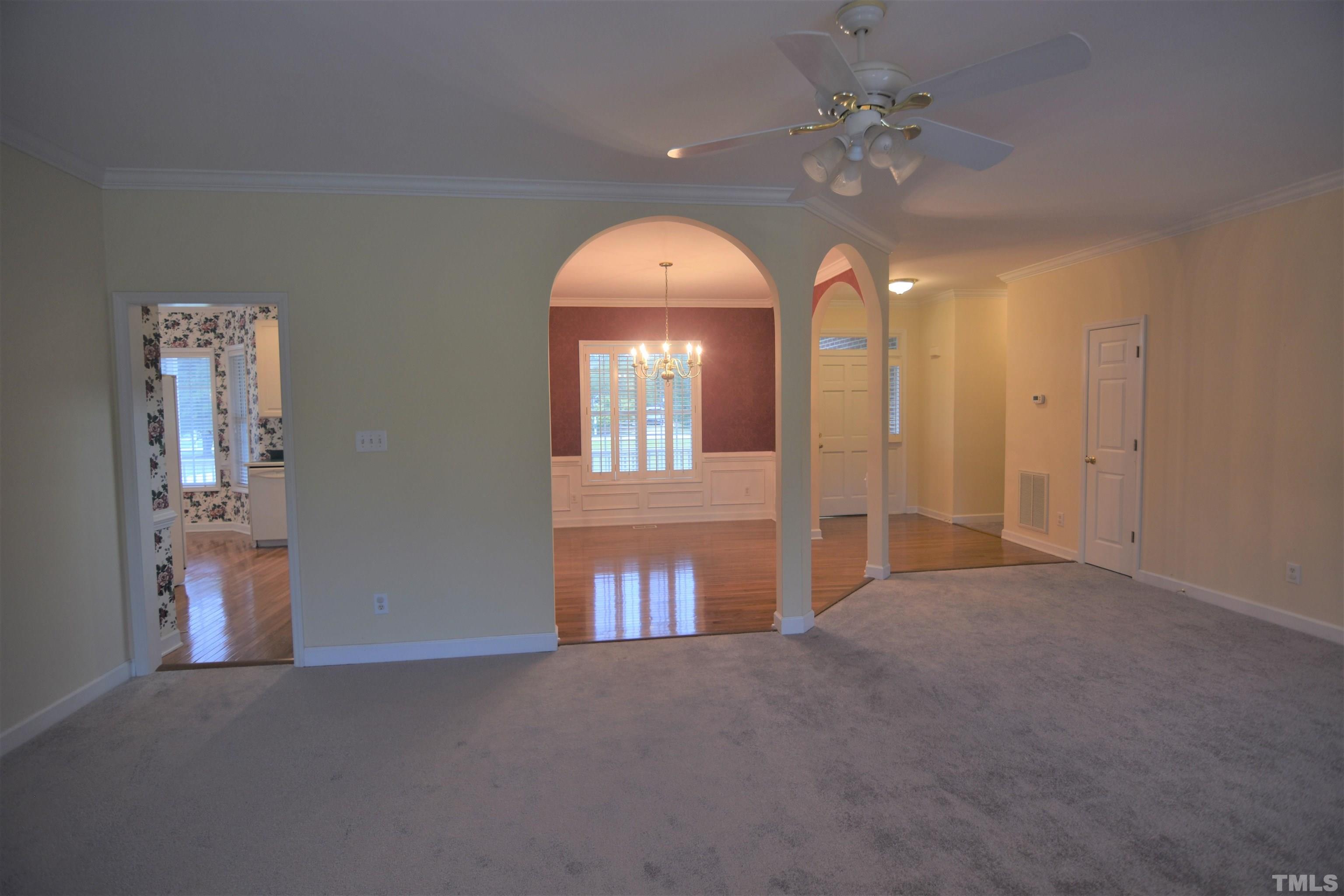 1025 Red Brick Road Garner, NC 27529 - Photo 17 of 30 a view of a room with a chandelier fan and a bathroom