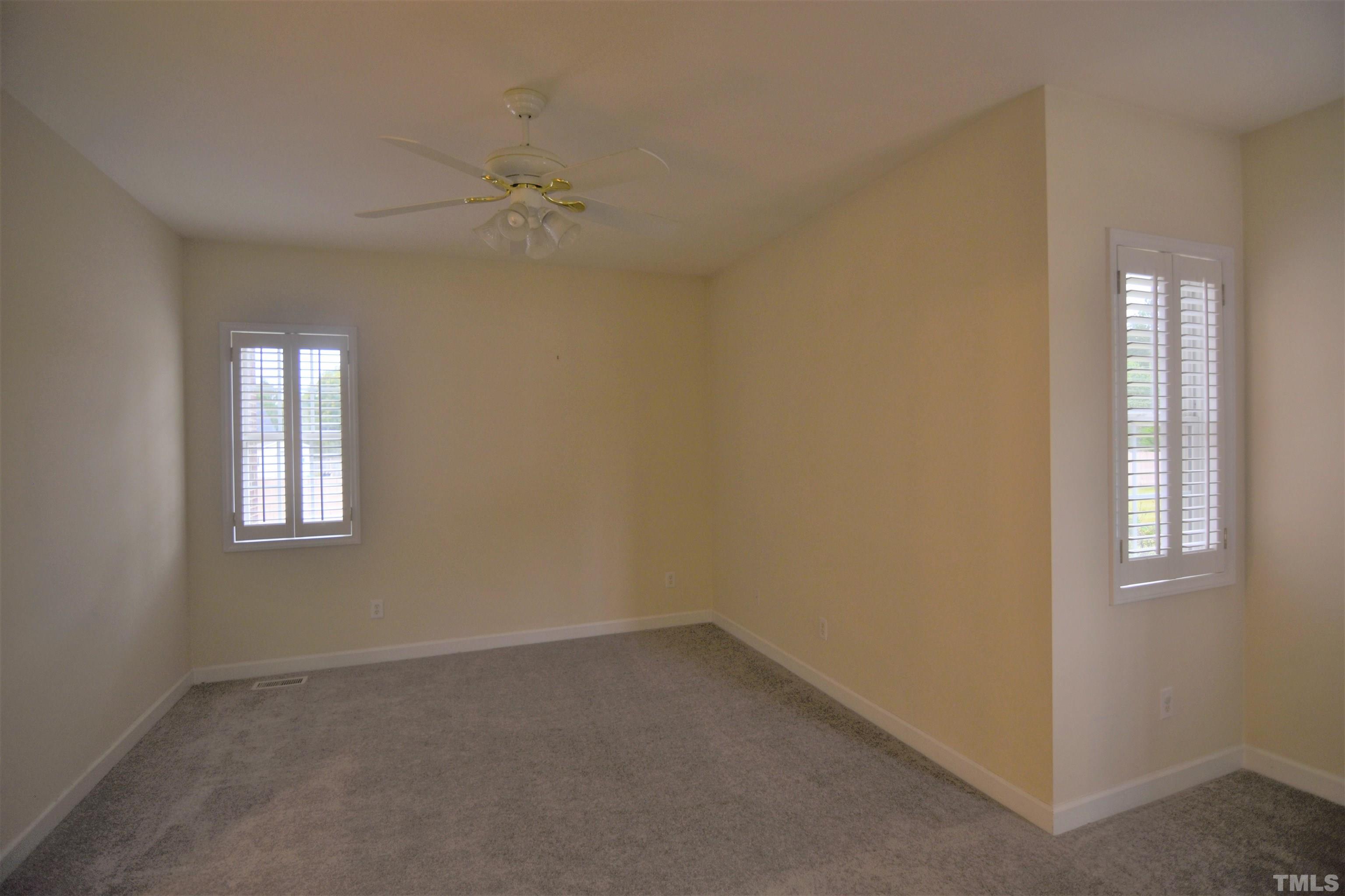 1025 Red Brick Road Garner, NC 27529 - Photo 20 of 30 an empty room with windows and closet