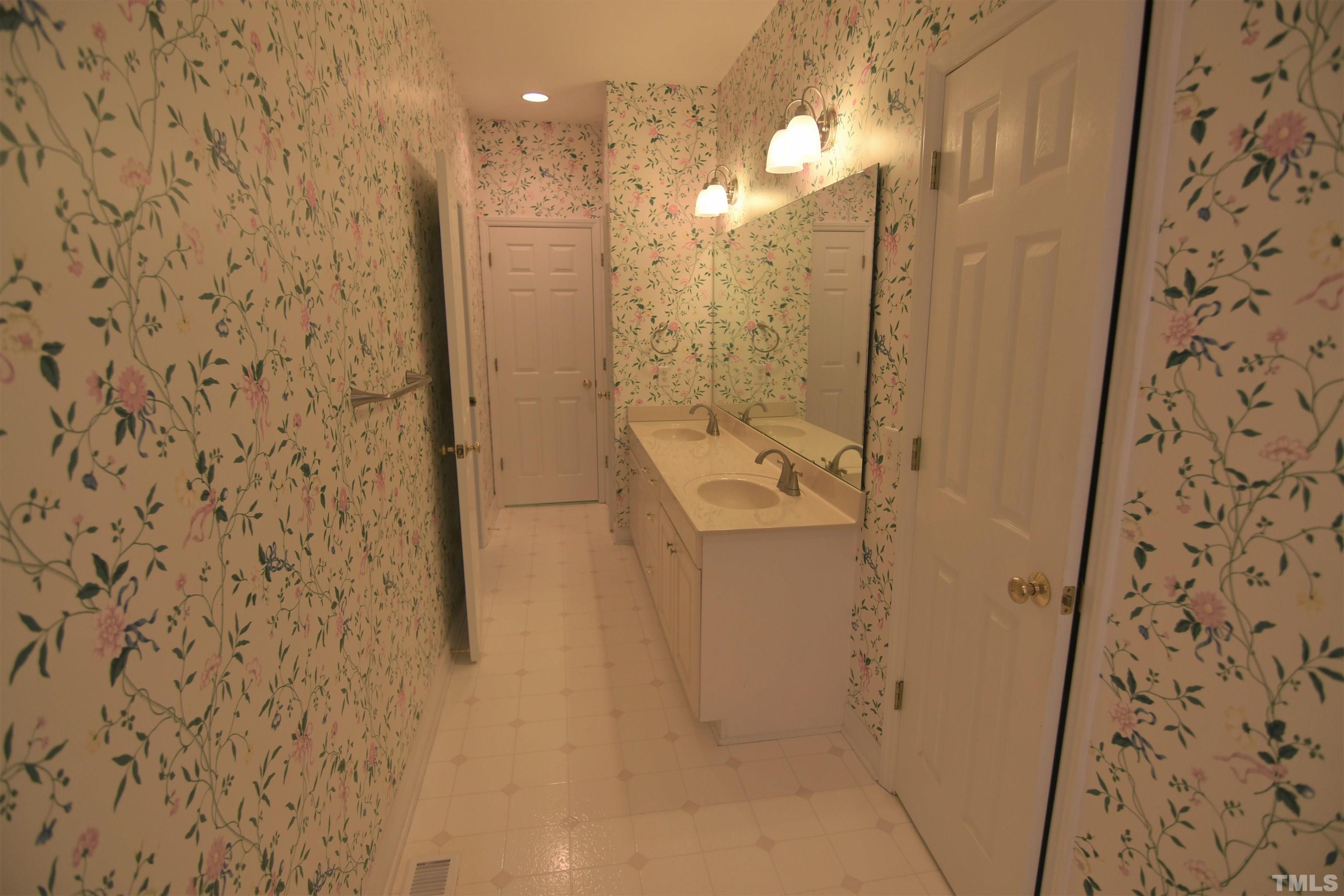 1025 Red Brick Road Garner, NC 27529 - Photo 22 of 30 a bathroom with a shower and a sink