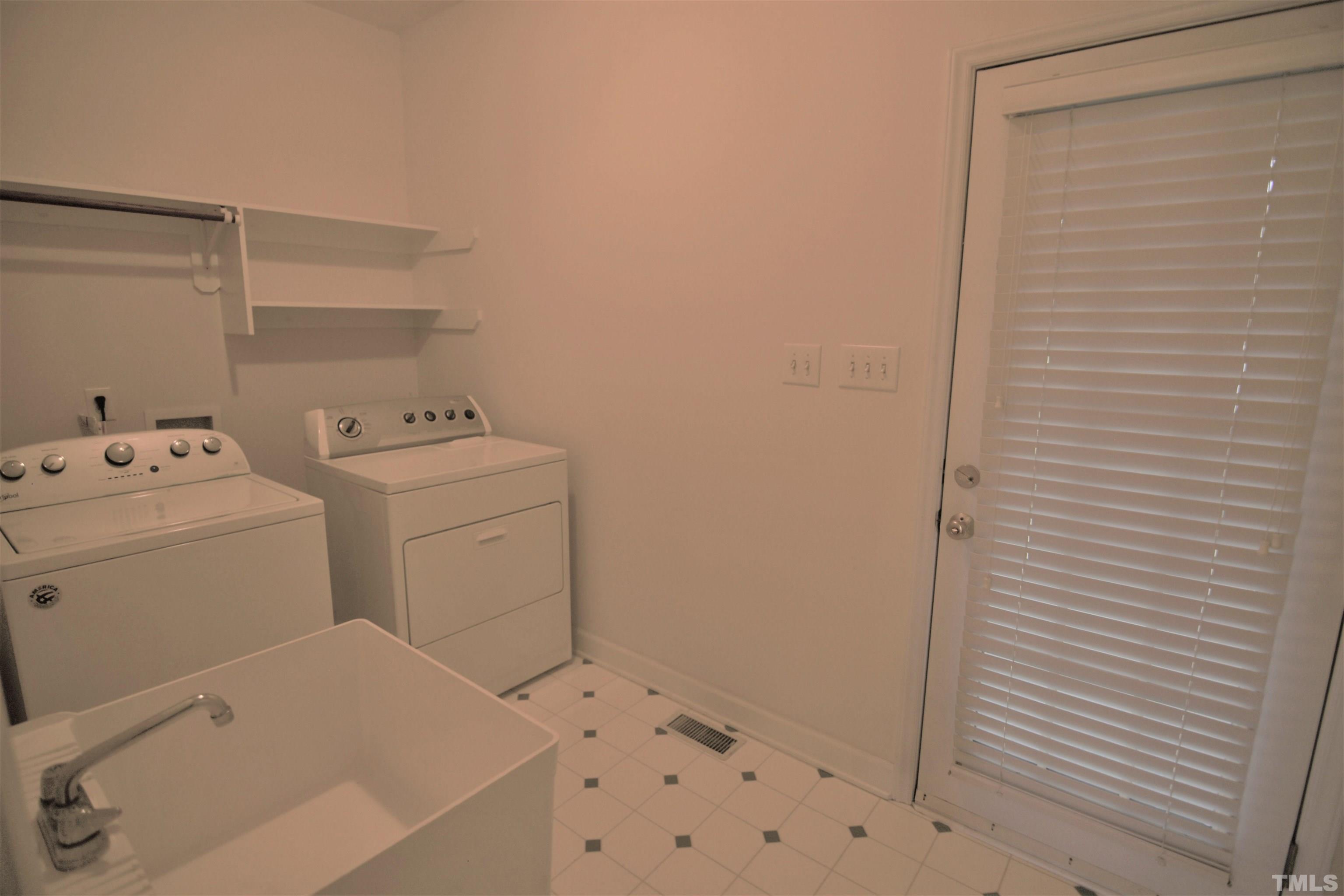 1025 Red Brick Road Garner, NC 27529 - Photo 27 of 30 a utility room with dryer and washer