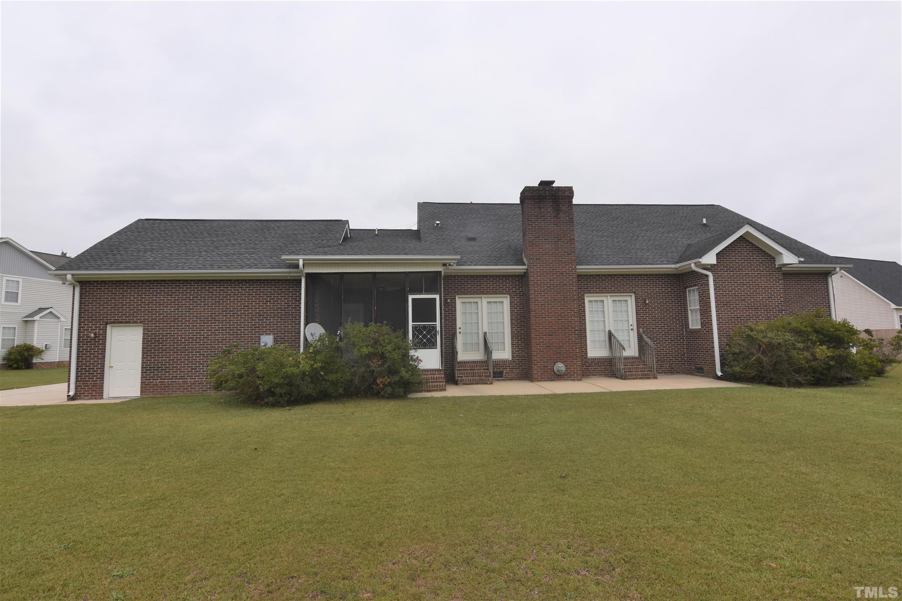 1025 Red Brick Road Garner, NC 27529 - Photo 29 of 30 a front view of house with yard and green space
