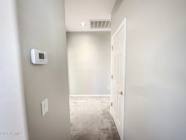 a kitchen with stainless steel appliances a sink a stove a refrigerator and cabinets