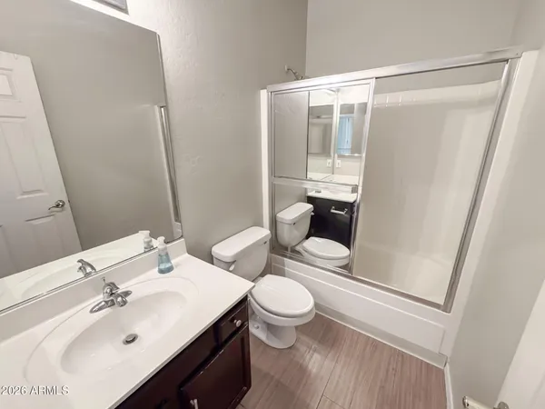 a view of a bathroom with wooden floor