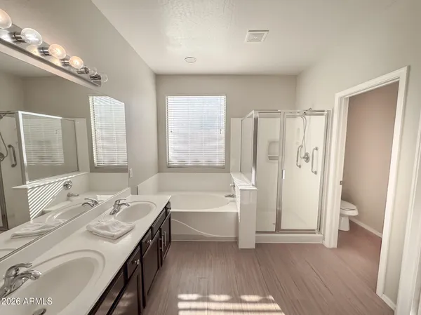 a bathroom with a bathtub and a sink
