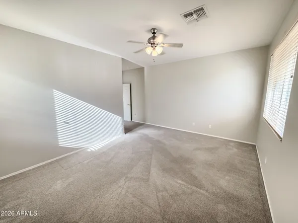 a view of an empty room with a window