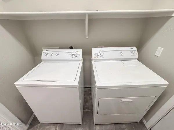 a utility room with dryer and washer