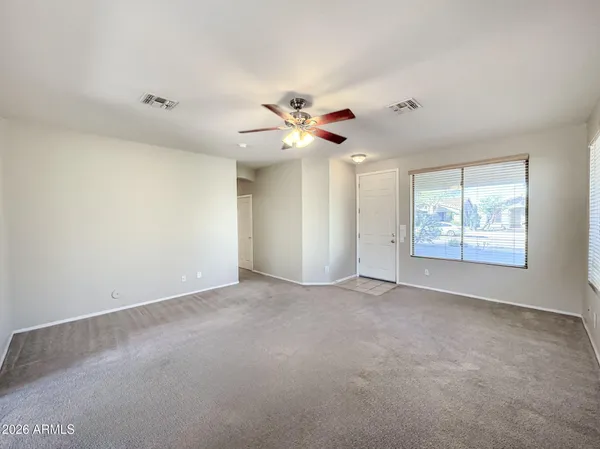 a view of an empty room with a window
