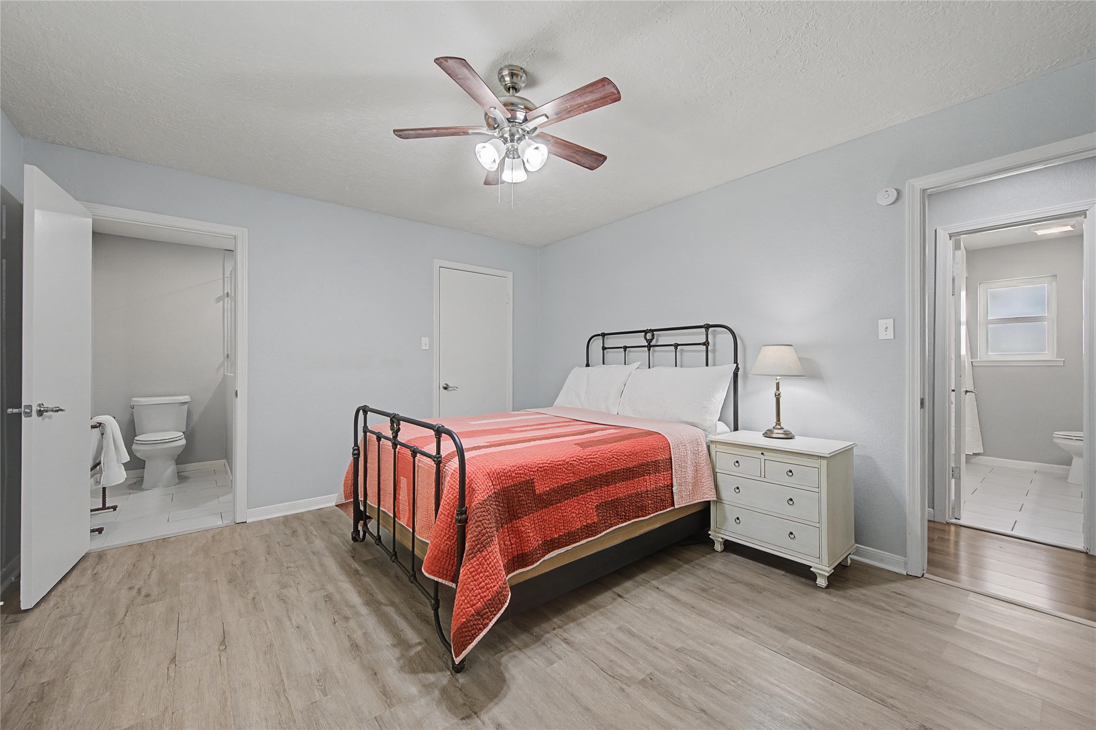 1719 Eastvale Drive Spring, TX 77386 - Photo 15 of 34 The primary bedroom features an en-suite bathroom and a walk-in closet.