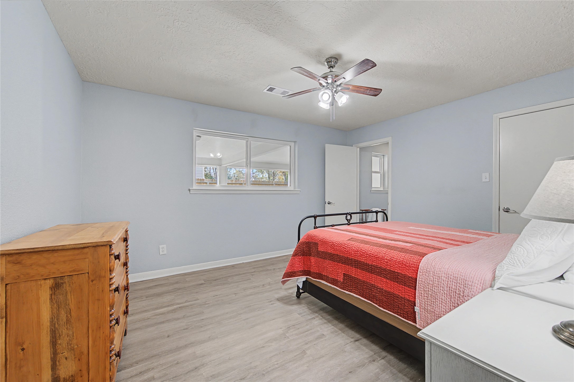 1719 Eastvale Drive Spring, TX 77386 - Photo 16 of 34 The primary bedroom features an en-suite bathroom and a walk-in closet.
