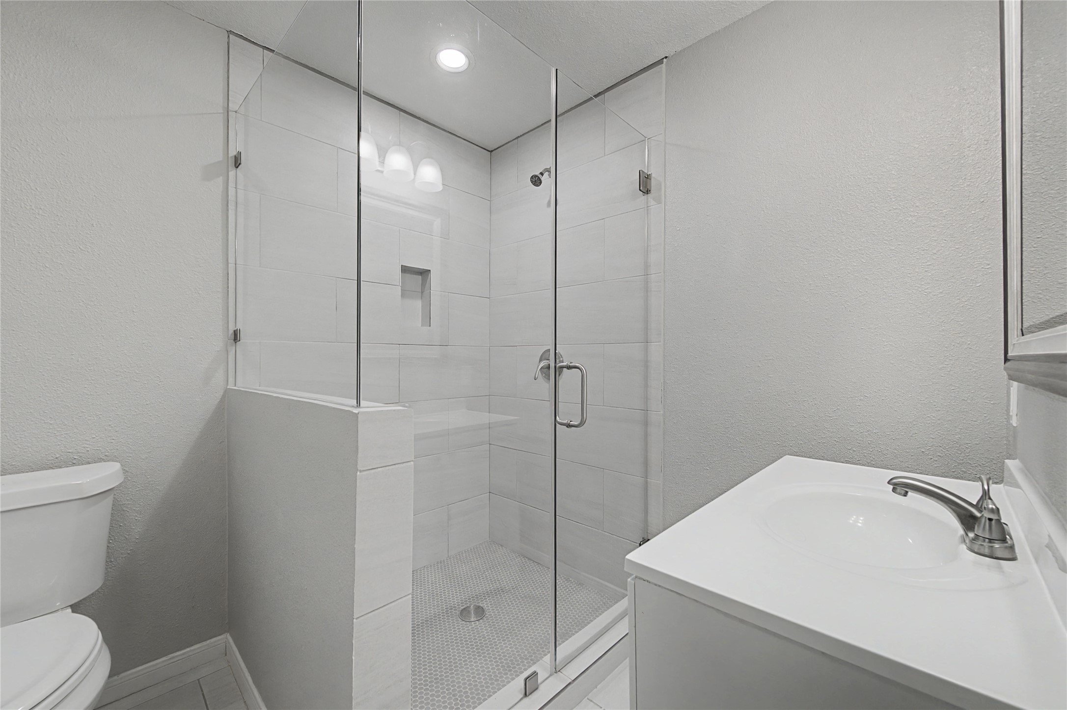1719 Eastvale Drive Spring, TX 77386 - Photo 17 of 34 The primary en-suite bathroom features a stylish bathroom with a frameless glass shower.