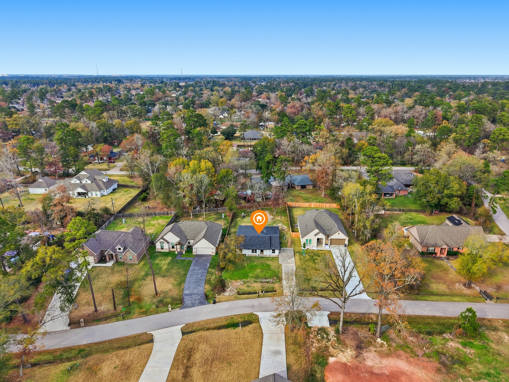 1719 Eastvale Drive Spring, TX 77386 - Photo 32 of 34 Located minutes from The Woodlands, yet tucked away on a generous lot, this property delivers the best of both worlds: freedom, space, and proximity. This 4-bedroom, 2.5-bath home sits on nearly 1/3 of an acre in the quiet, unrestricted neighborhood of Spring Hills North. No HOA restrictions provide you the flexibility for a home-based business, workshop, trailer, boat, etc.