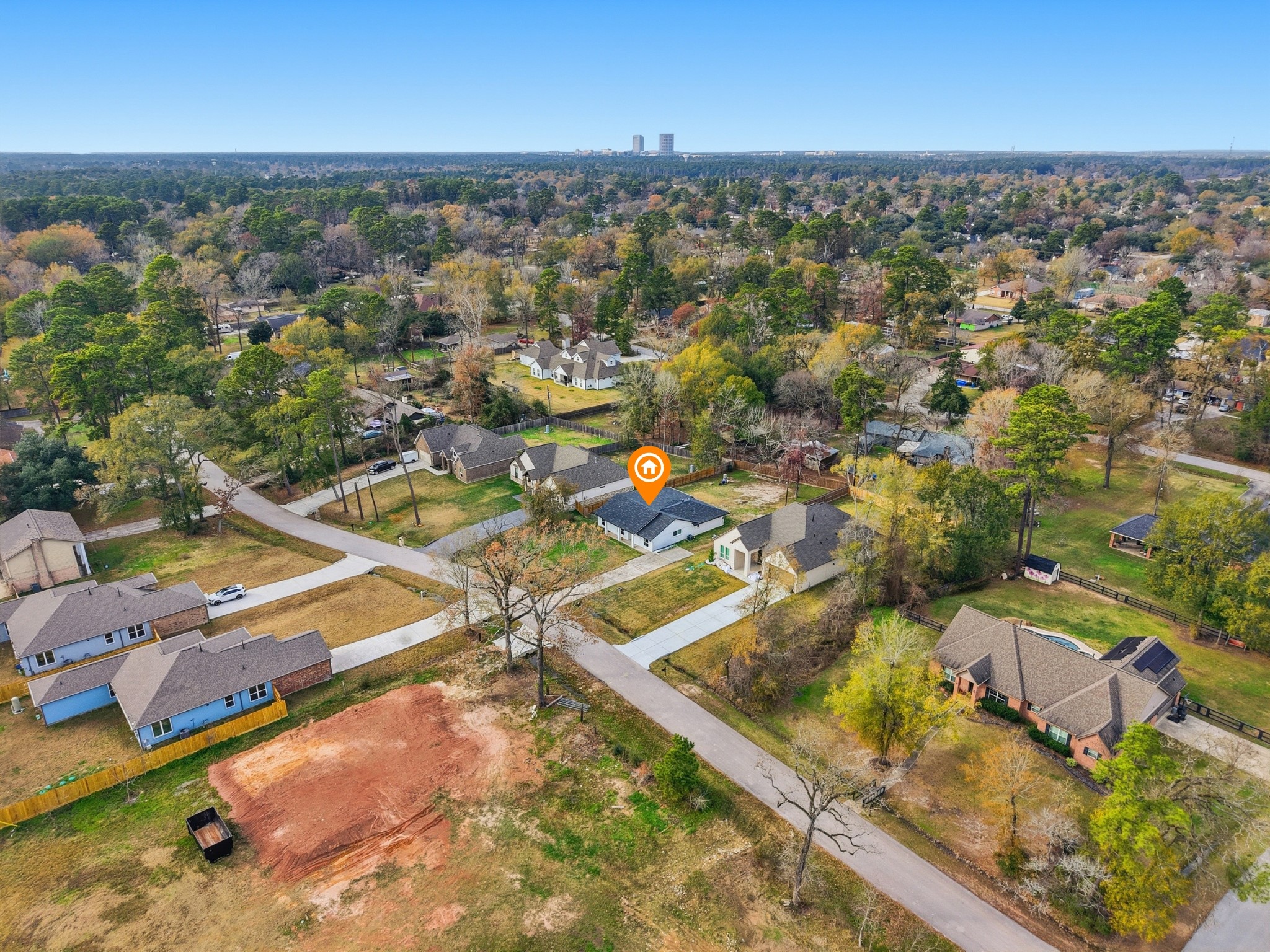 1719 Eastvale Drive Spring, TX 77386 - Photo 33 of 34 Located minutes from The Woodlands, yet tucked away on a generous lot, this property delivers the best of both worlds: freedom, space, and proximity. This 4-bedroom, 2.5-bath home sits on nearly 1/3 of an acre in the quiet, unrestricted neighborhood of Spring Hills North. No HOA restrictions provide you the flexibility for a home-based business, workshop, trailer, boat, etc.