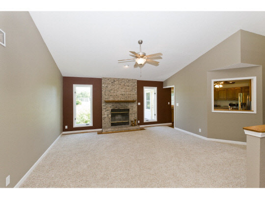 4283 Waltham Road Roscoe, IL 61073 - Photo 6 of 11 a view of an empty room with a fireplace