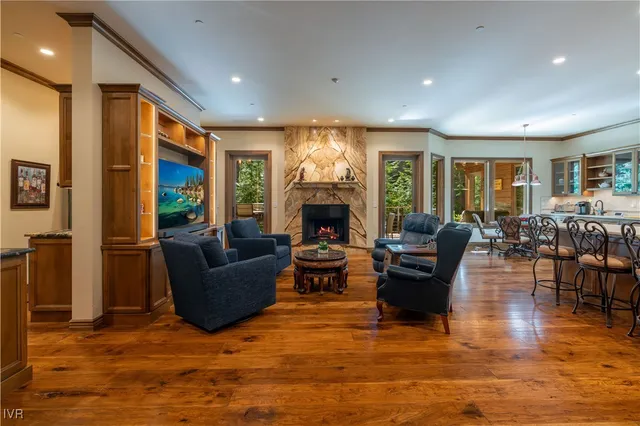a living room with furniture fireplace and flat screen tv