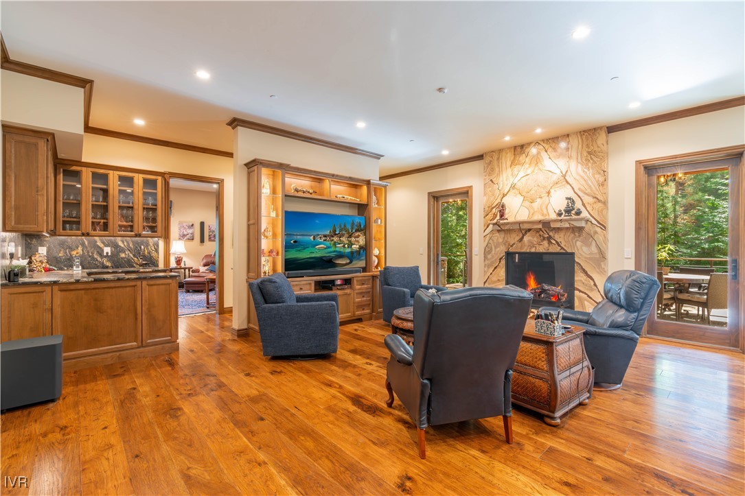 250 Pine Cone Road Incline Village, NV 89451 - Photo 19 of 50 a living room with furniture a large window and a fireplace