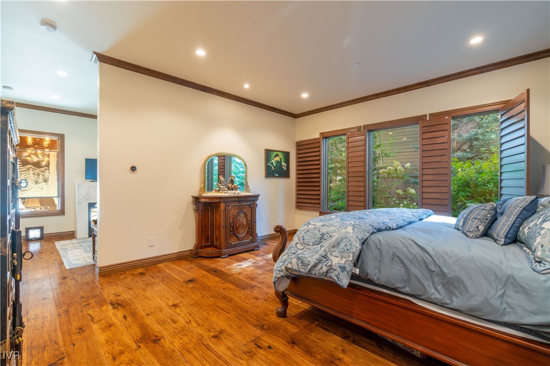 250 Pine Cone Road Incline Village, NV 89451 - Photo 21 of 50 a bedroom with a large bed and a large window