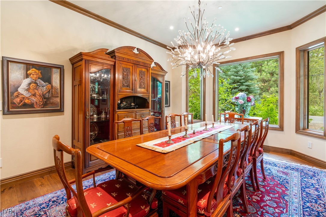 250 Pine Cone Road Incline Village, NV 89451 - Photo 31 of 50 a view of a dining room with furniture wooden floor and chandelier