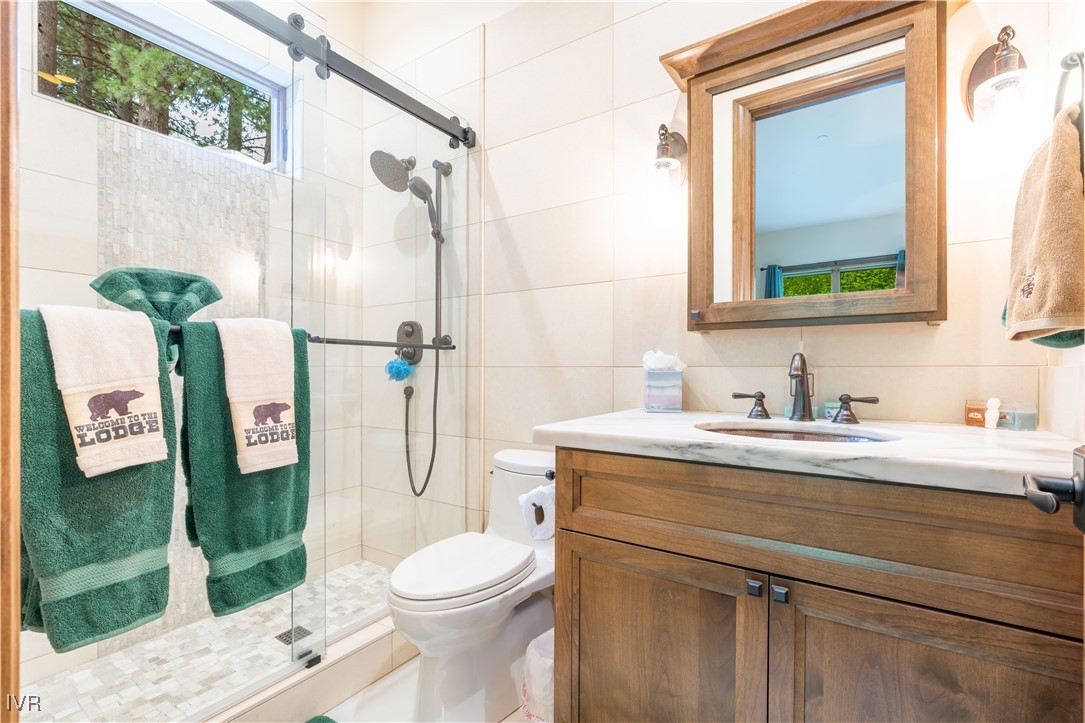 250 Pine Cone Road Incline Village, NV 89451 - Photo 38 of 50 a bathroom with a granite countertop toilet sink and shower