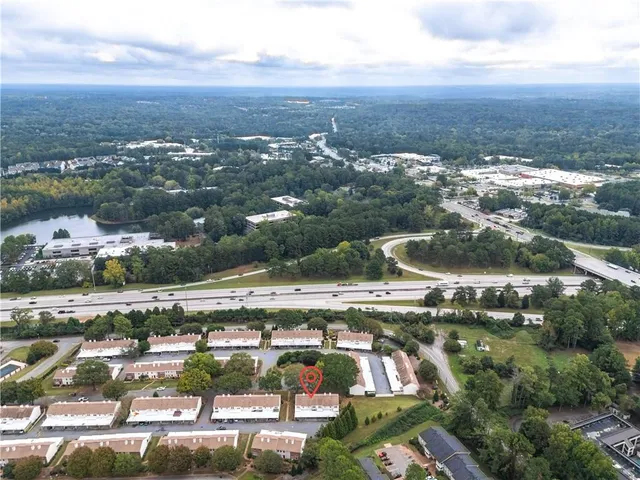 an aerial view of residential houses with outdoor space