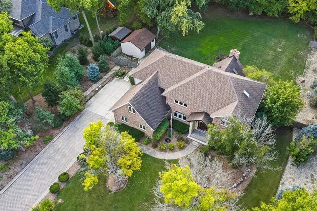 an aerial view of a house with a garden and plants