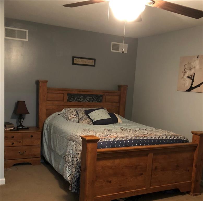 763 Oneida Valley Road Butler, PA 16001 - Photo 11 of 24 a bed sitting in a bedroom next to a lamp