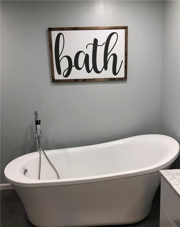 763 Oneida Valley Road Butler, PA 16001 - Photo 13 of 24 a white bath tub sitting in a bathroom