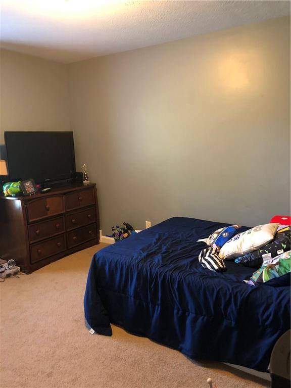763 Oneida Valley Road Butler, PA 16001 - Photo 17 of 24 a bedroom with a bed and television