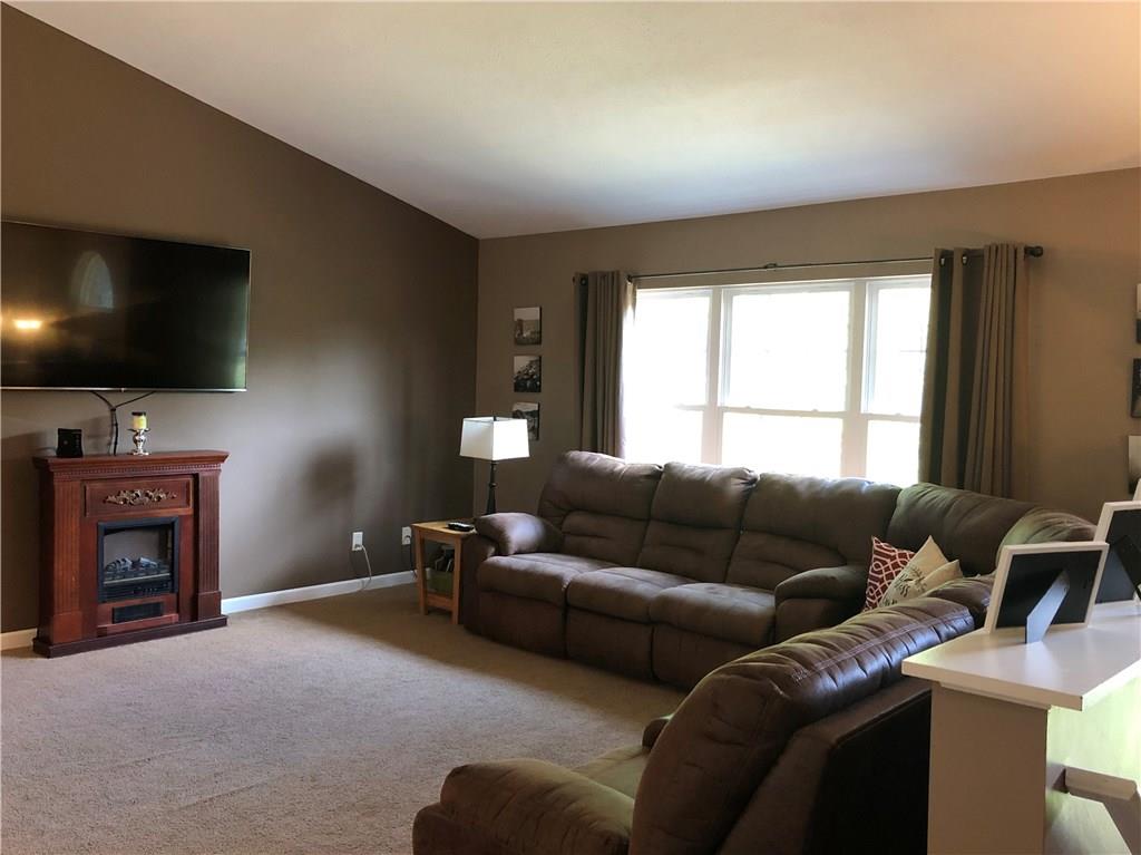 763 Oneida Valley Road Butler, PA 16001 - Photo 2 of 24 a living room with furniture and a flat screen tv