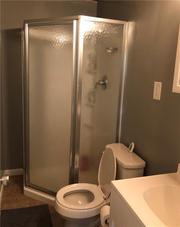 763 Oneida Valley Road Butler, PA 16001 - Photo 22 of 24 a white toilet sitting next to a bathroom sink