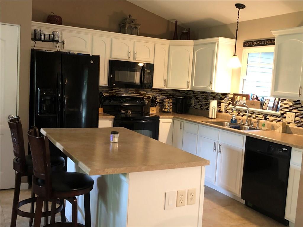 763 Oneida Valley Road Butler, PA 16001 - Photo 5 of 24 a kitchen with a stove a sink and a refrigerator