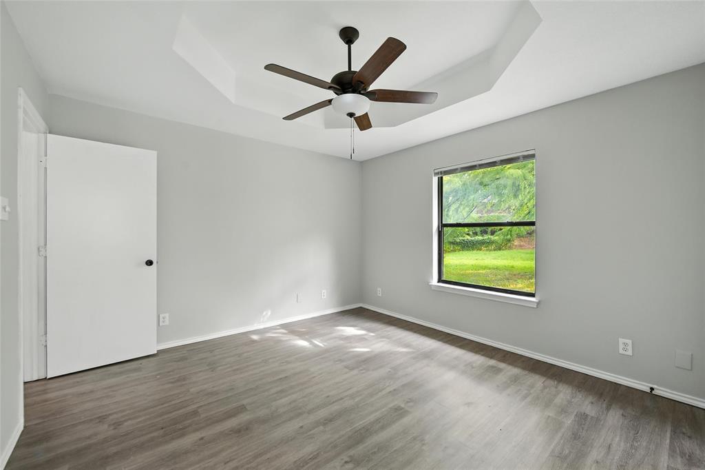 602 Valleyridge Court Decatur, TX 76234 - Photo 21 of 27 a view of an empty room with a window