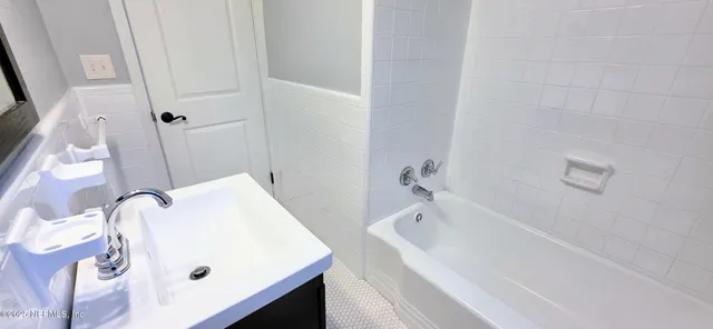 a view of a backyard with a tree