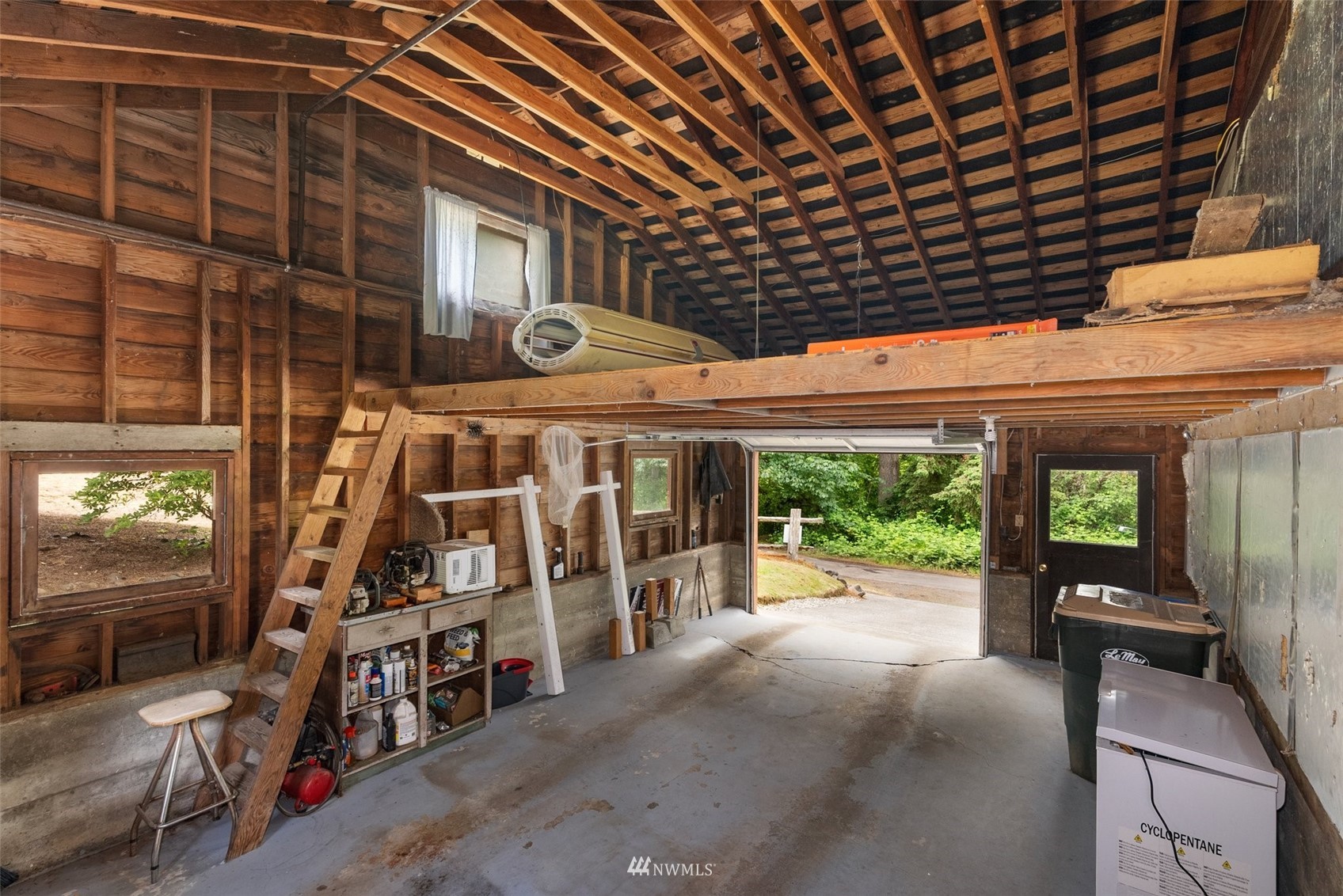 916 Southeast Korpi Way Winlock, WA 98596 - Photo 21 of 31 a view of a porch with furniture and a garage