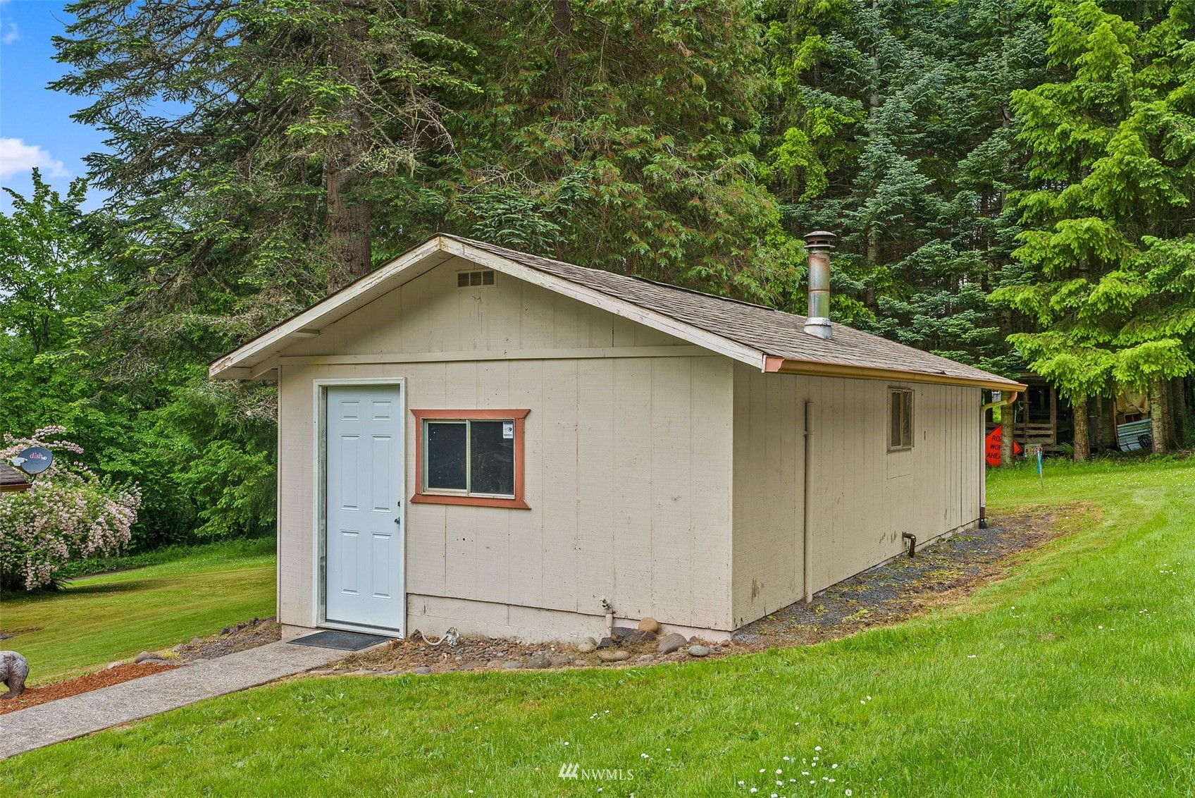 916 Southeast Korpi Way Winlock, WA 98596 - Photo 24 of 31 a house with green field in front of it