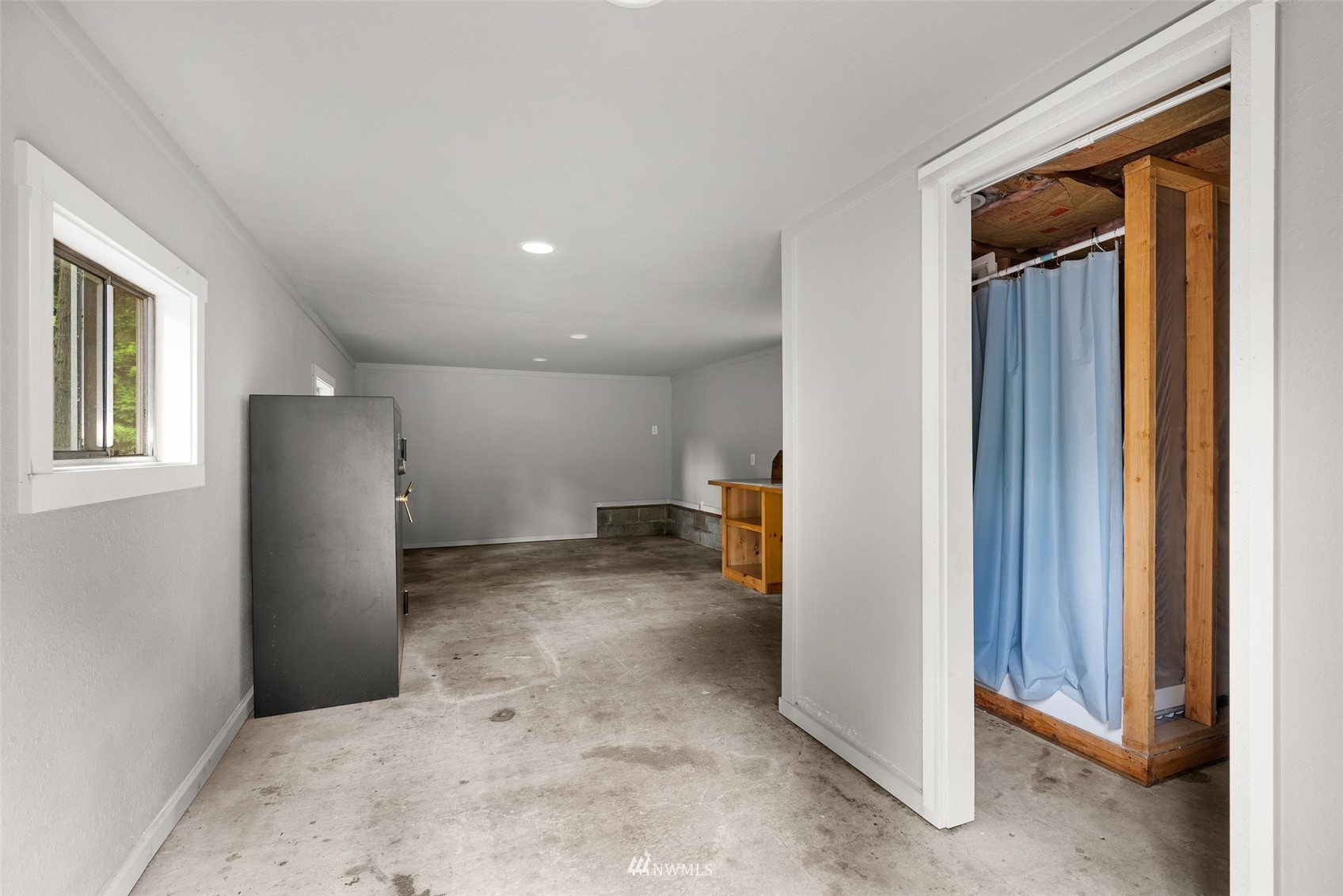 916 Southeast Korpi Way Winlock, WA 98596 - Photo 26 of 31 a view of a room with a refrigerator and closet