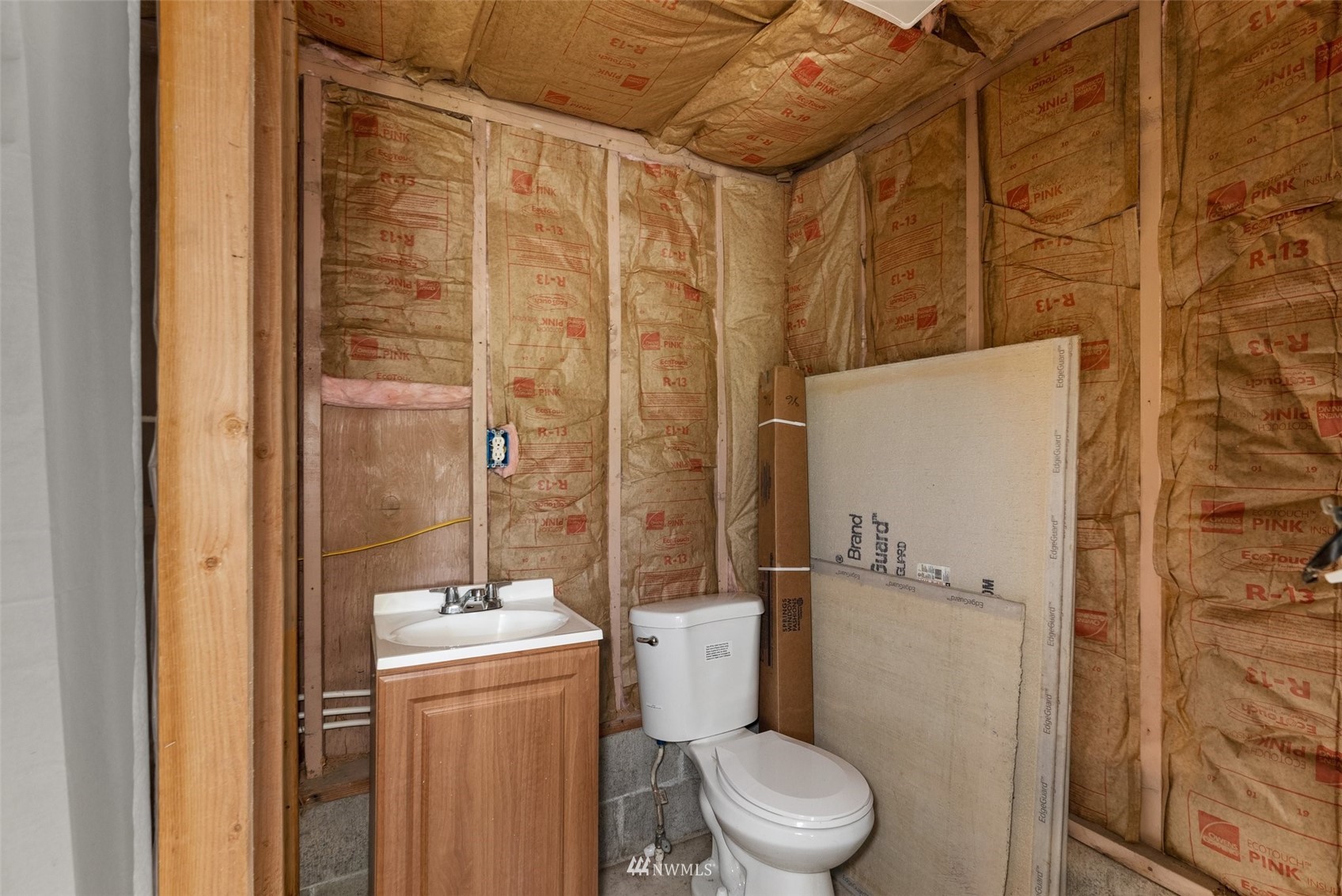 916 Southeast Korpi Way Winlock, WA 98596 - Photo 28 of 31 a bathroom with a granite countertop sink toilet and shower