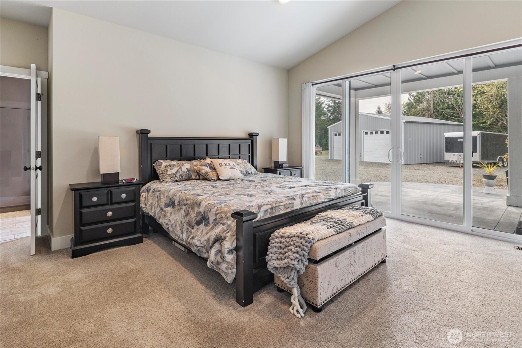 20025 Southeast 232nd Street Maple Valley, WA 98038 - Photo 17 of 40 a bedroom with a bed and large mirror