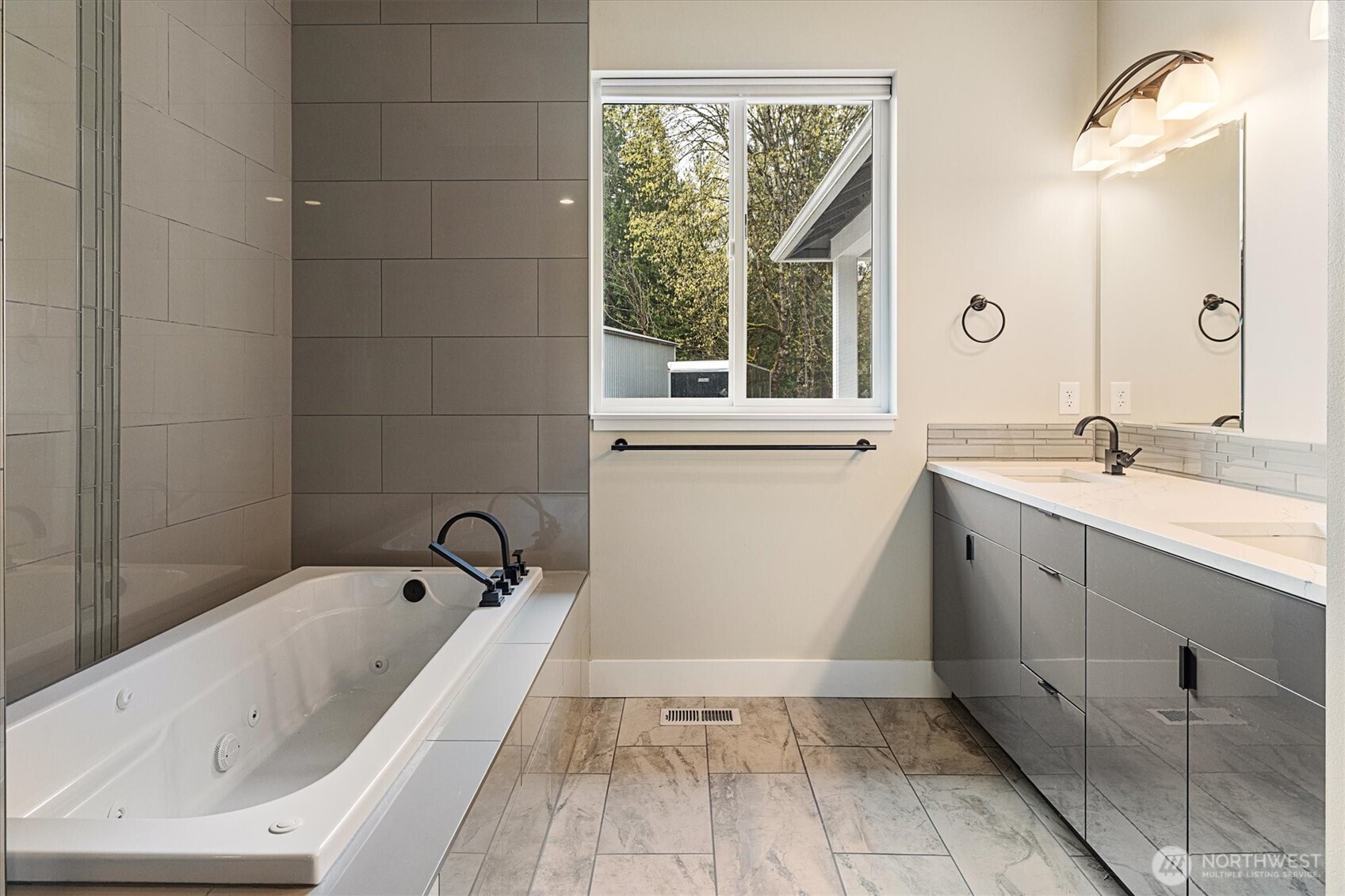 20025 Southeast 232nd Street Maple Valley, WA 98038 - Photo 19 of 40 a bathroom with a tub sink and window