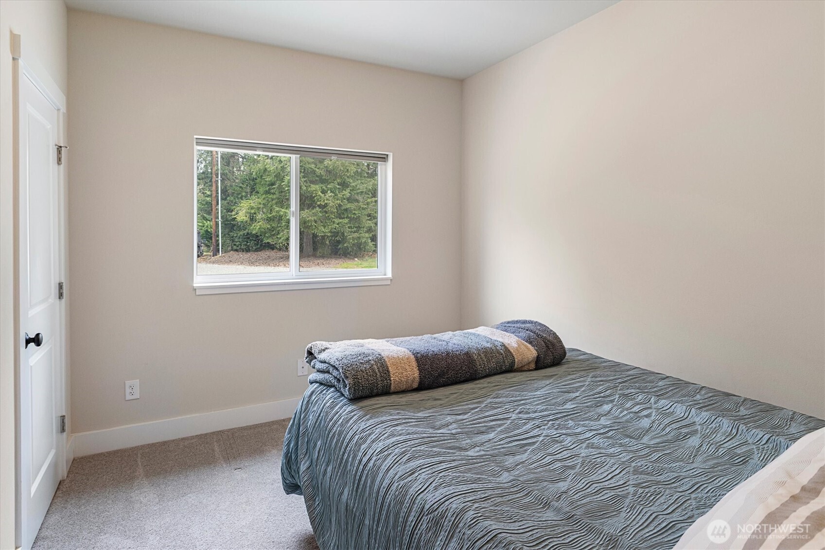 20025 Southeast 232nd Street Maple Valley, WA 98038 - Photo 23 of 40 a bedroom with a bed and window