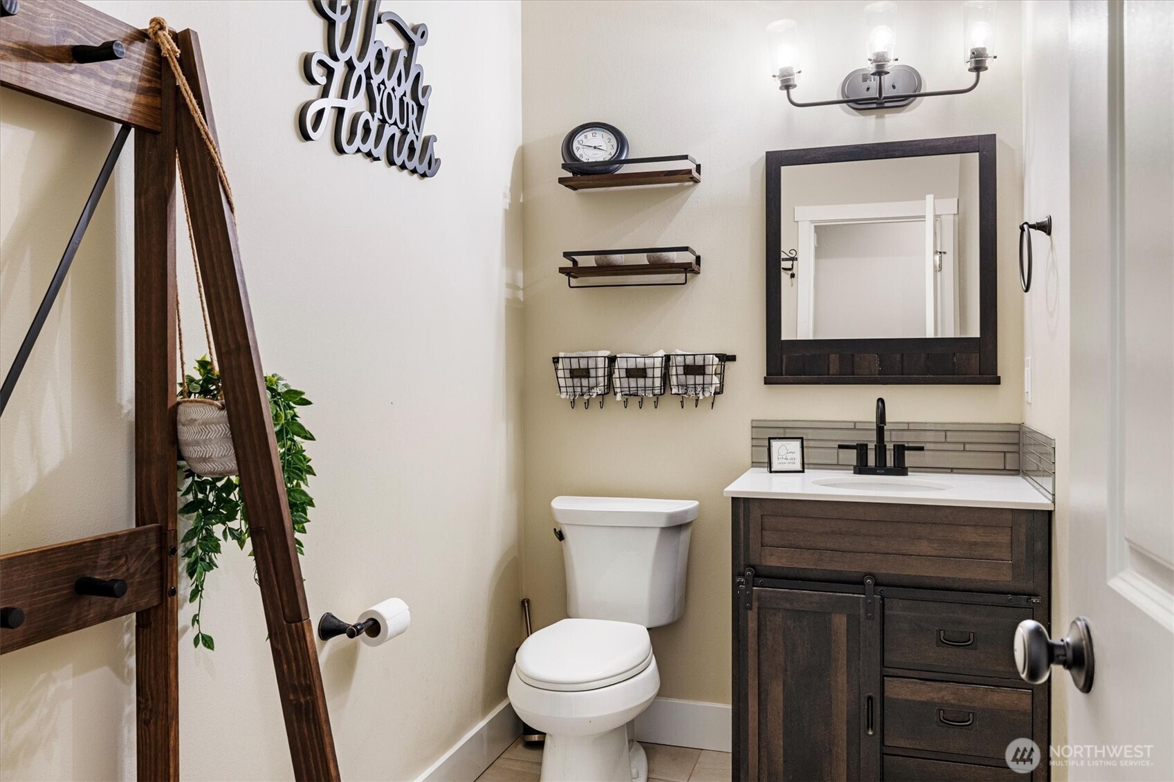20025 Southeast 232nd Street Maple Valley, WA 98038 - Photo 24 of 40 a bathroom with a toilet sink and mirror