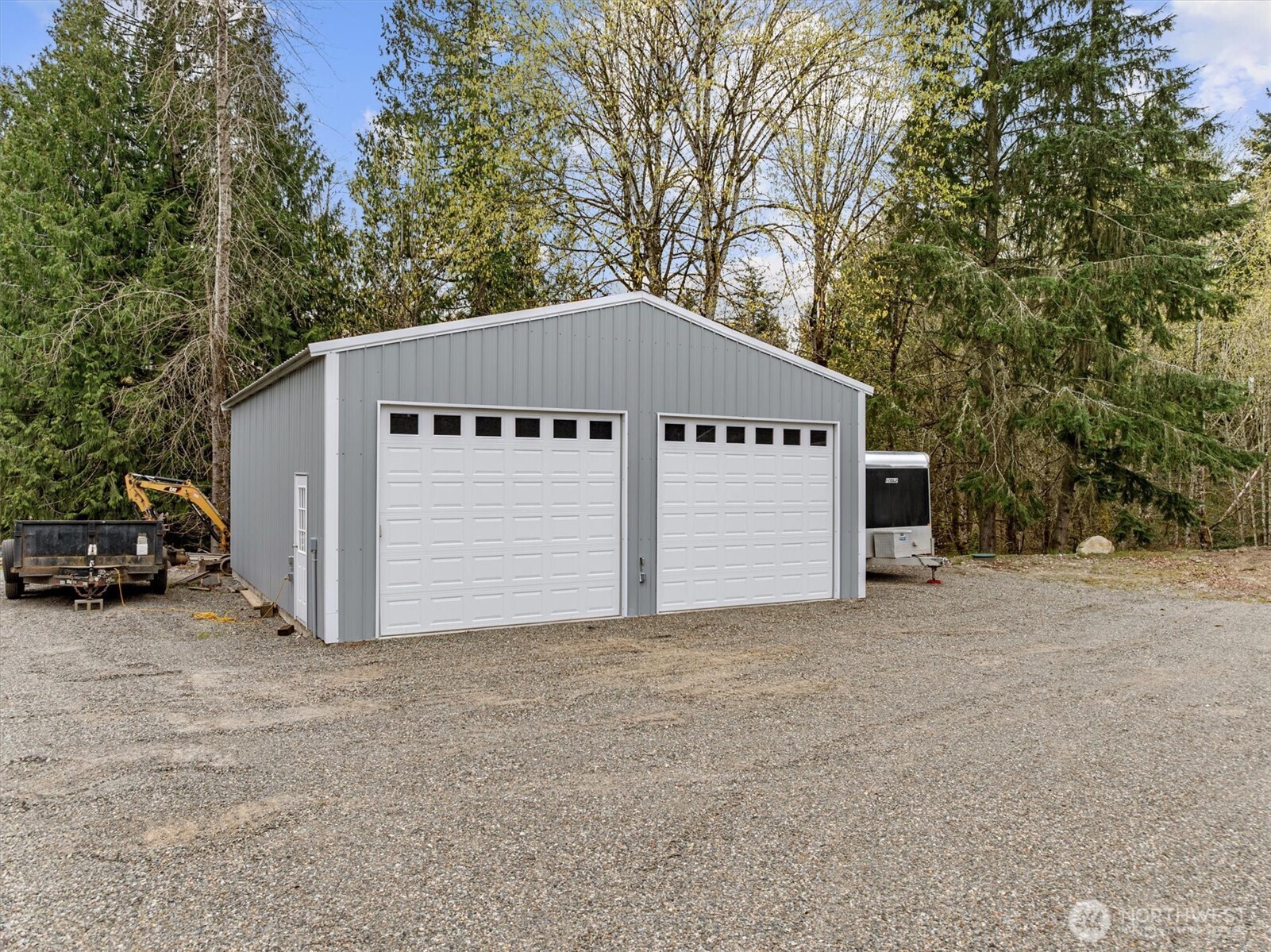 20025 Southeast 232nd Street Maple Valley, WA 98038 - Photo 26 of 40 a view of a house with a yard garage and trees