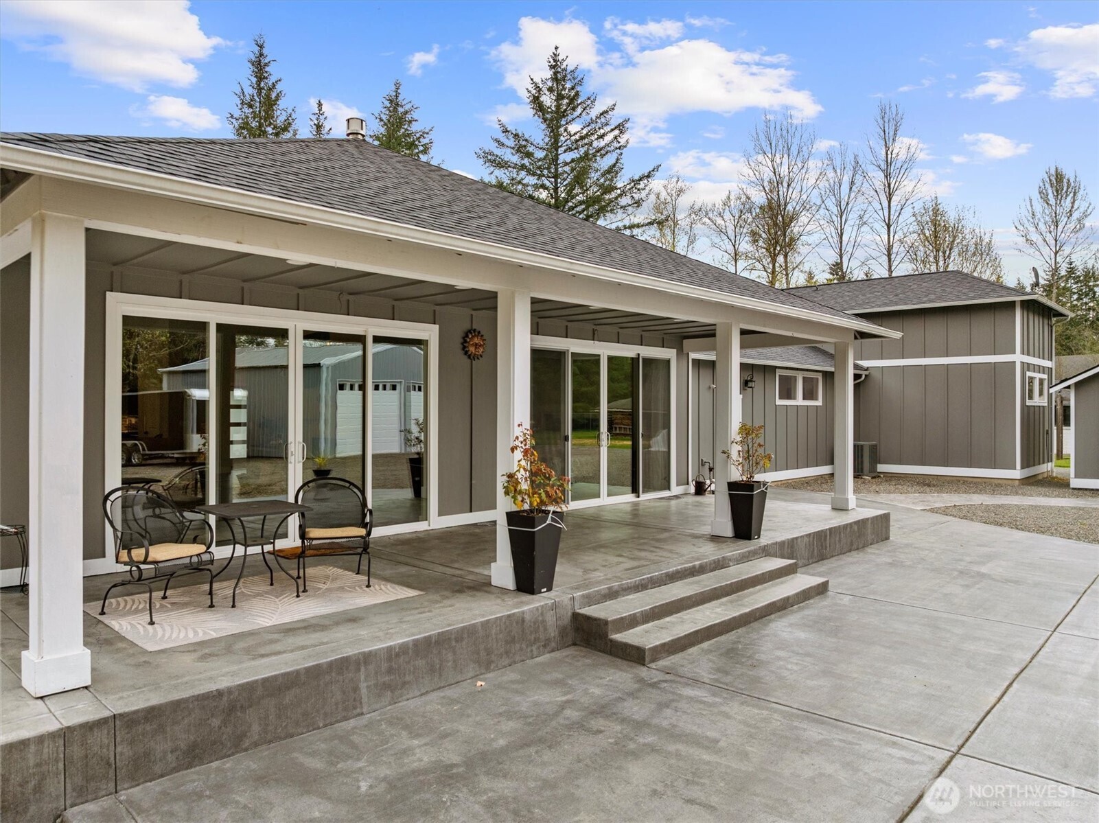 20025 Southeast 232nd Street Maple Valley, WA 98038 - Photo 27 of 40 a building exterior with furniture