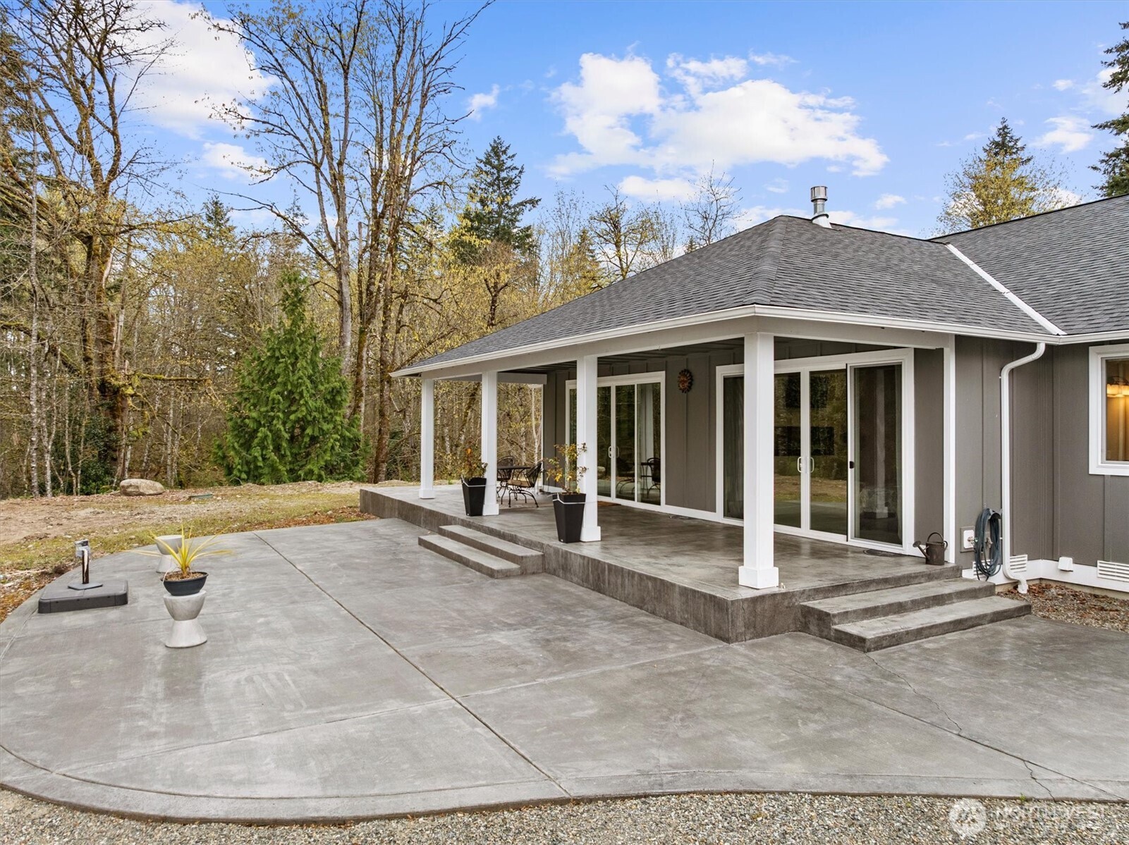 20025 Southeast 232nd Street Maple Valley, WA 98038 - Photo 29 of 40 a view of a house with backyard and sitting area