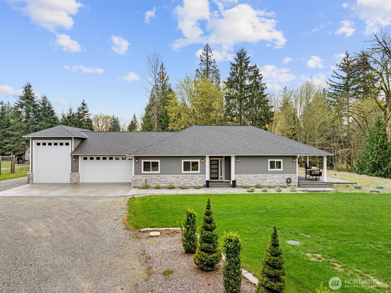 20025 Southeast 232nd Street Maple Valley, WA 98038 - Photo 3 of 40 a house view with a garden space