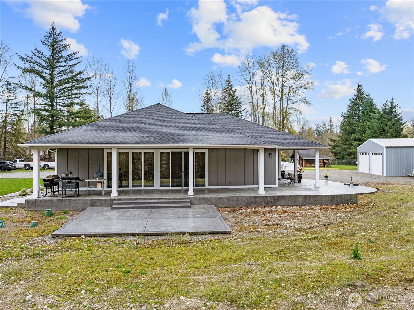 20025 Southeast 232nd Street Maple Valley, WA 98038 - Photo 31 of 40 a front view of a house with swimming pool