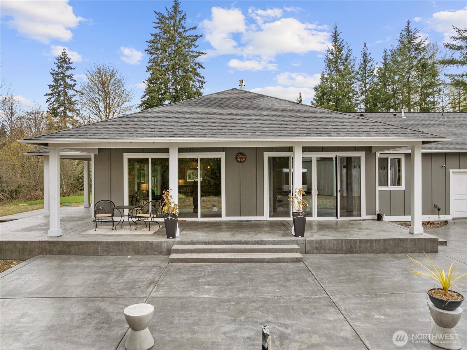 20025 Southeast 232nd Street Maple Valley, WA 98038 - Photo 32 of 40 a front view of a house with a garden and plants