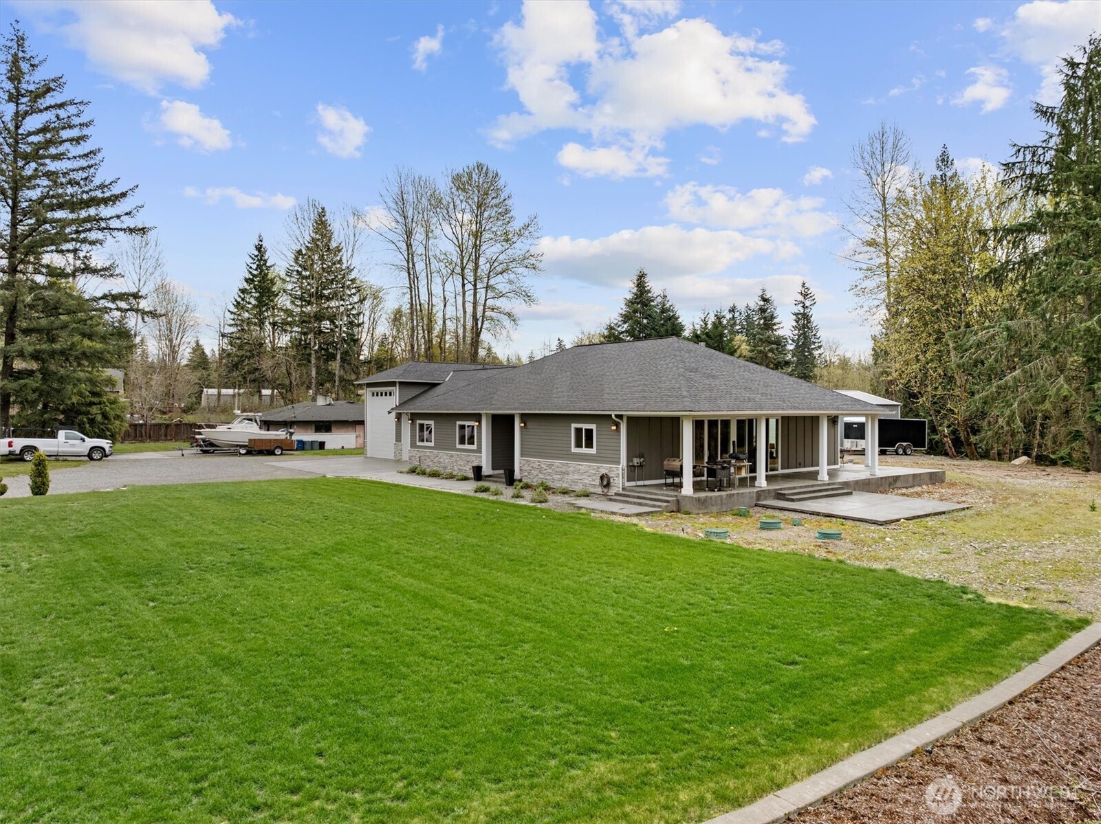 20025 Southeast 232nd Street Maple Valley, WA 98038 - Photo 37 of 40 a view of a house with a yard