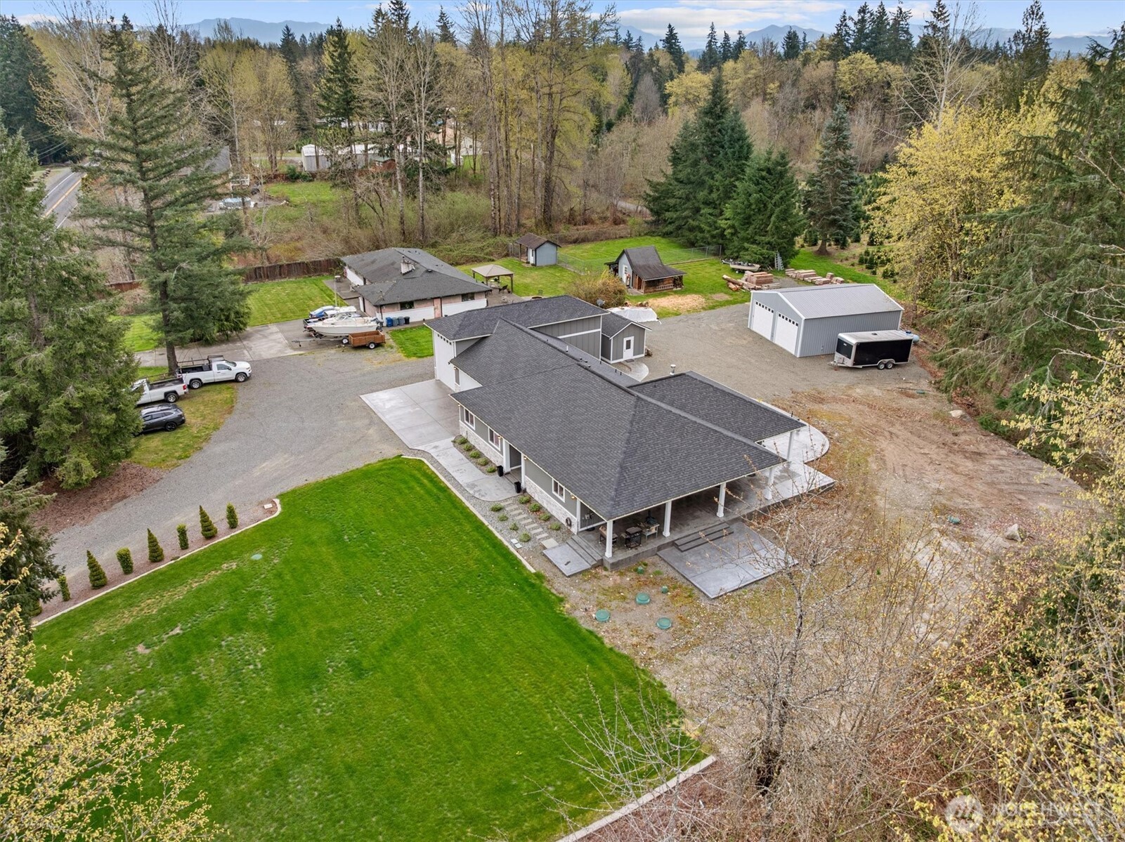 20025 Southeast 232nd Street Maple Valley, WA 98038 - Photo 38 of 40 an aerial view of a house with garden space and street view