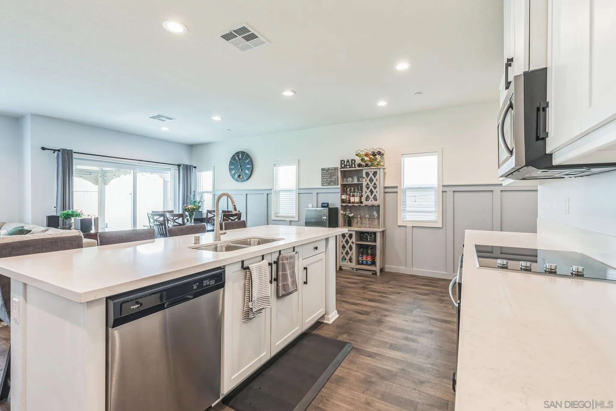 5522 Starlight Place Bonsall, CA 92003 - Photo 14 of 32 a large kitchen with stainless steel appliances granite countertop a sink and a stove