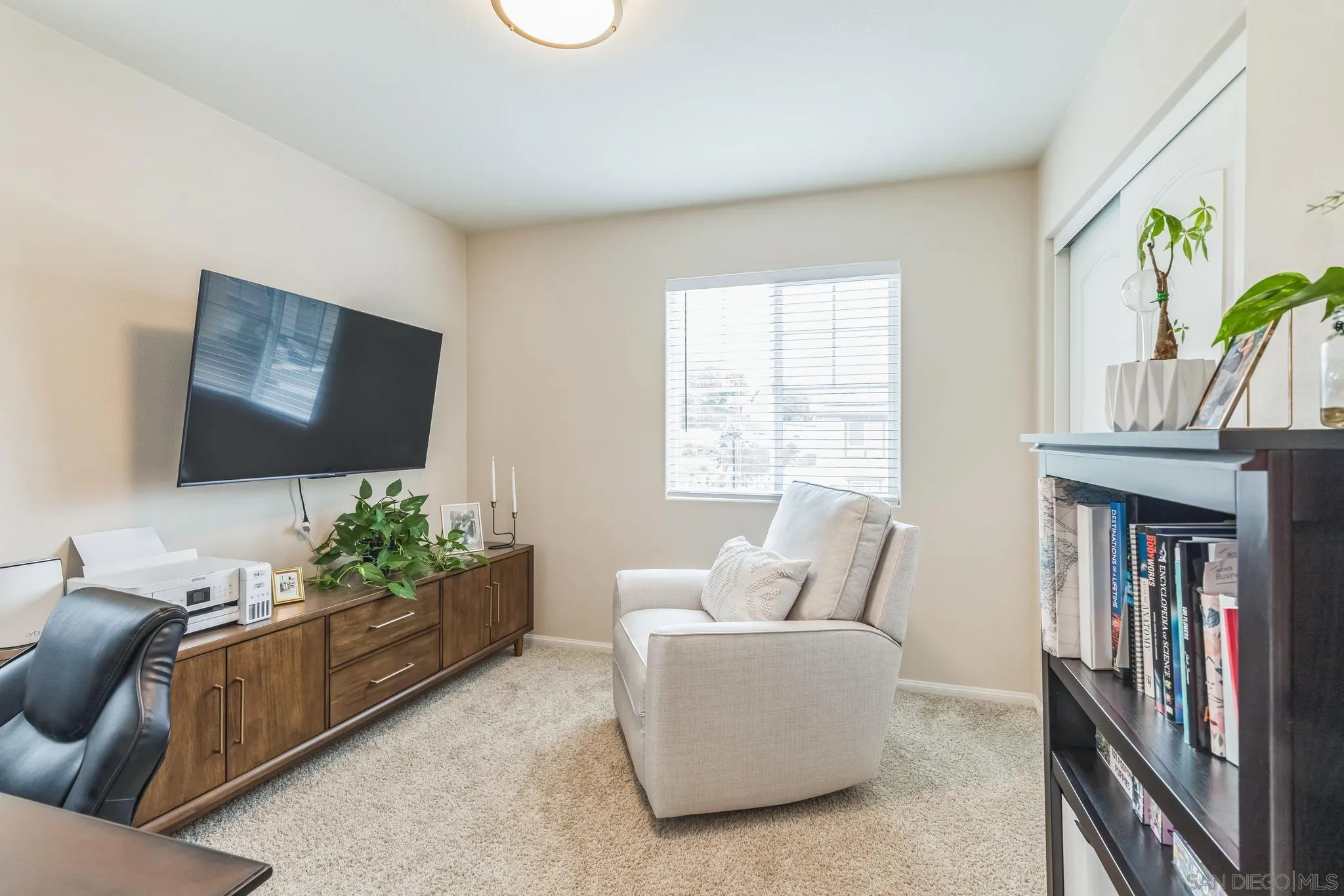 5522 Starlight Place Bonsall, CA 92003 - Photo 21 of 32 a living room with furniture and a flat screen tv